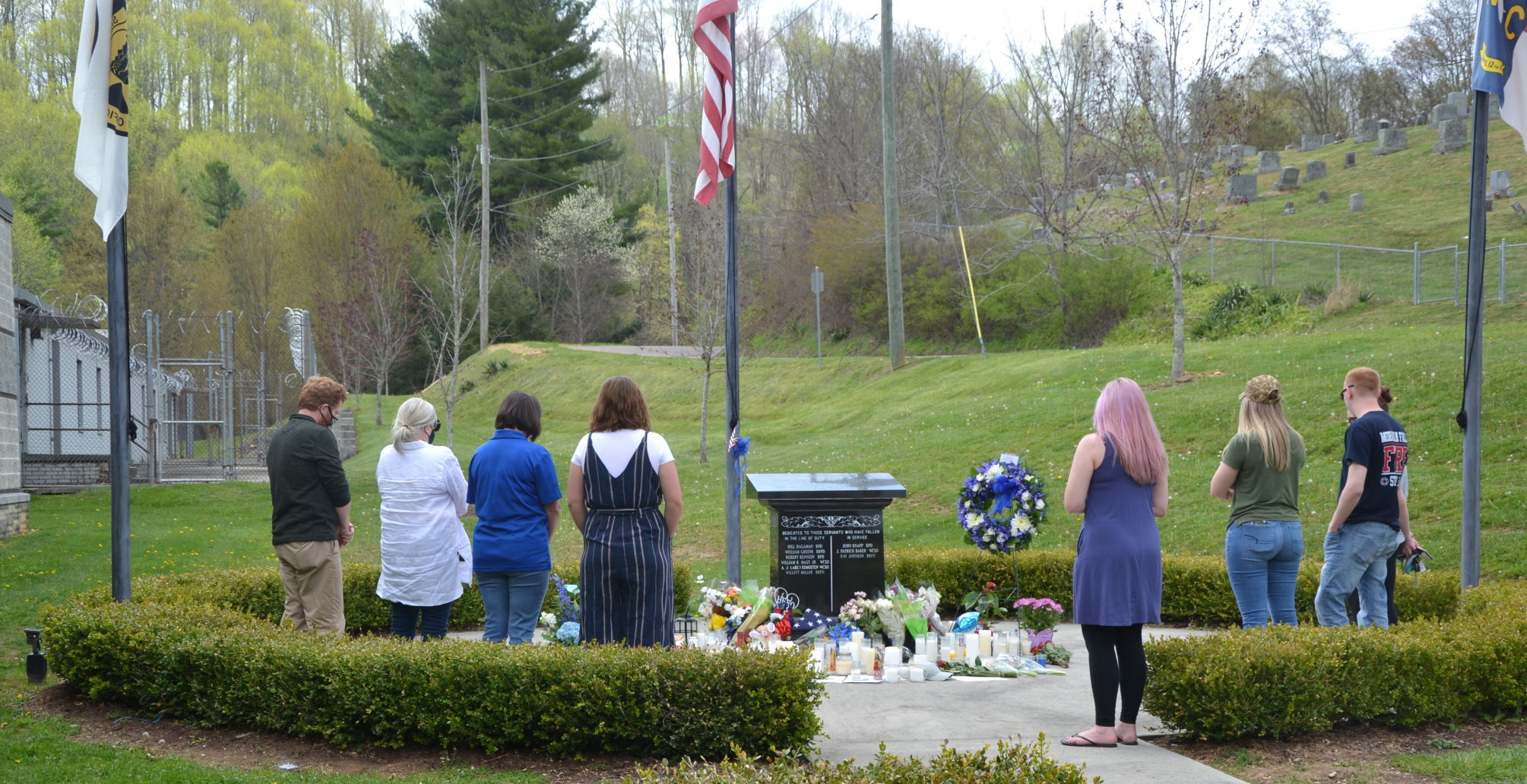 Community members at the memorial